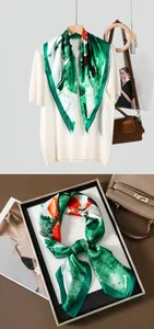 Detail showing high-quality satin silk scarf with artistic green and orange floral print