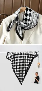 Detail of silk-like scarf with black and white checkerboard and abstract line art patterns