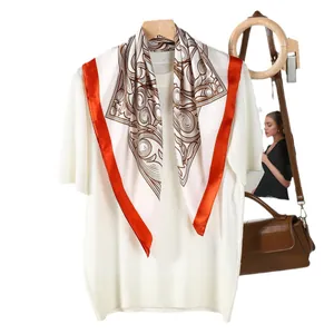 White short-sleeve knit top paired with a vintage floral silk scarf in orange and brown