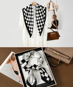 Detailed view of black and white checkerboard silk scarf with abstract line art patterns