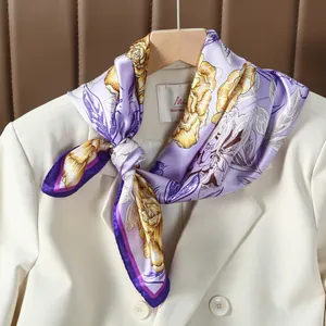 Elegant purple silk scarf with yellow rose print tied on a beige blazer collar