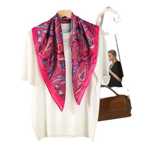Magenta paisley silk scarf with bohemian peacock pattern styled on white knitwear