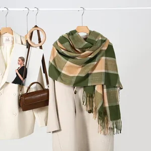 Detail of plaid cashmere-feel scarf with fringe, green and beige check pattern