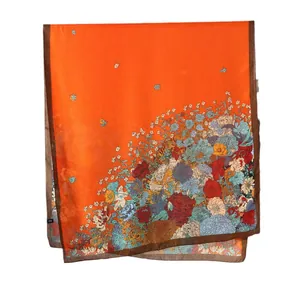 Floral print orange shawl wrap for women made of lightweight fabric with brown border
