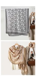 Detail of elegant printed scarves with vintage patterns and silky texture on a plain background