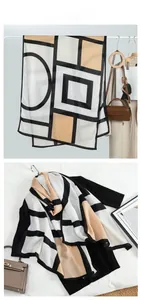 Detail showing contrast geometric pattern and fine texture of the thin velvet shawl scarf