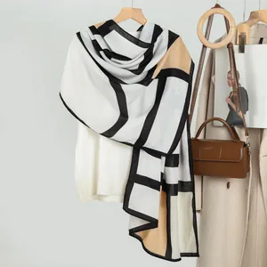 Women's geometric color block scarf in ivory, black and khaki as stylish autumn shawl