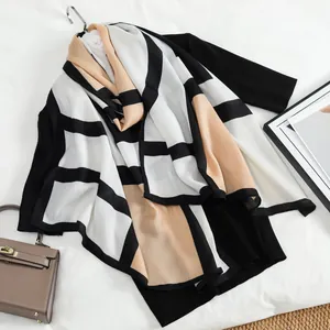 Velvet winter shawl with color block geometric patterns for women in black and beige