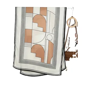 Elegant beige silk scarf with brown geometric patterns and black minimalist lines