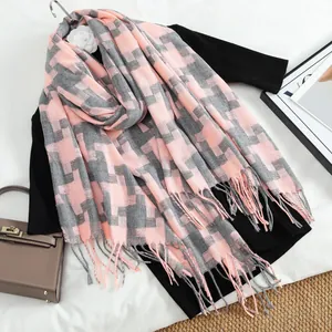 Pink and grey houndstooth scarf with tassels on a black knit top for autumn/winter