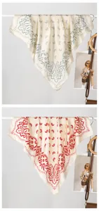 Detail showing paisley and floral print silk scarves in blue and red color options