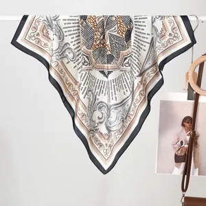 Detail of silk-like square scarf featuring baroque patterns and bohemian geometric motifs