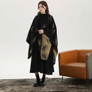 Elegant black knit shawl cape for women with golden ginkgo leaf jacquard patterns