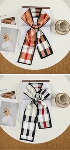 Dettaglio di due foulard in seta con motivi a quadretti arancio caldo e grigio classico