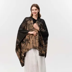Women's reversible jacquard knit poncho shawl with abstract pattern in black and khaki