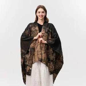 Women's jacquard knit poncho shawl with brown and black abstract patterns