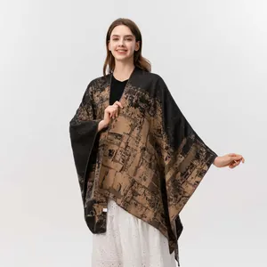 Women's double-sided jacquard poncho shawl in black and khaki with abstract knit patterns