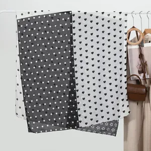 Women's lightweight black and white scarf with polka dots, hearts, and star patterns