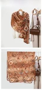 Detail of warm brown paisley scarf featuring lightweight translucent cotton-linen texture