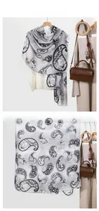 Detail of grey paisley scarf with elegant patterns in flat lay and hanging display