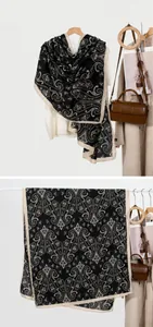 Detail of vintage black paisley scarf showing hanging drape and full pattern layout