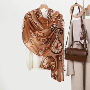 Elegant large brown paisley print cotton linen scarf shawl displayed on wooden hanger