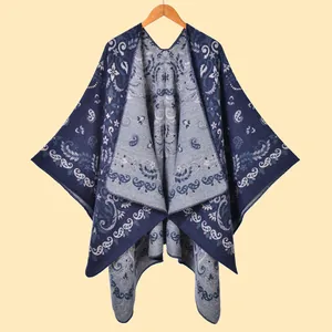 Close-up of vintage dark blue shawl showing intricate paisley jacquard weave and texture