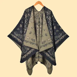 Detail of bohemian jacquard knit shawl featuring paisley patterns and olive green border