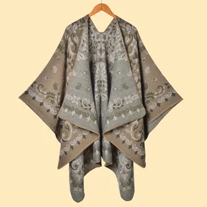 Close-up of vintage leopard paisley knit shawl featuring detailed floral weaving patterns