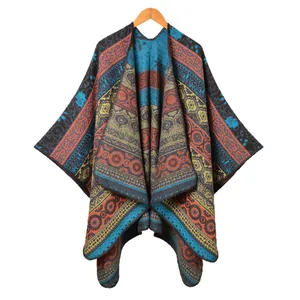 Bohemian knit poncho with vintage geometric patterns and tassels on white background