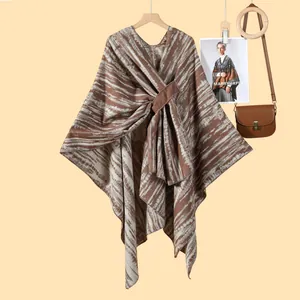 Detail of knit shawl featuring brown stripes and elegant lace-up front closure