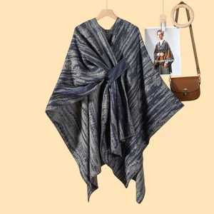Women's blue zebra pattern knit poncho cape with a stylish asymmetric twisted front design
