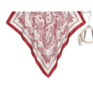 Silk-like red and white paisley square scarf with a wide border, elegantly draped