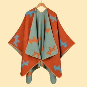 Detailed knit texture and Scottie dog jacquard pattern on reversible winter shawl