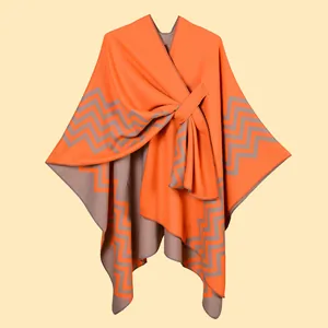 Detail of orange and grey wave pattern shawl with wrap-around strap closure