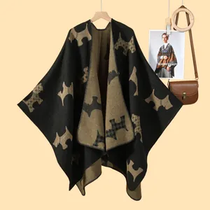 Detail of soft knit shawl featuring a double-sided Scottie Dog jacquard pattern texture