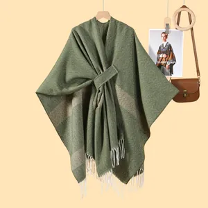 Olive green striped knit poncho with fringe details and tie-waist for women