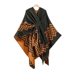Women's wave pattern knit poncho cardigan in charcoal grey and burnt orange split colors