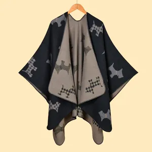 Close-up of knitted shawl with Scottish Terrier silhouette patterns and thick texture
