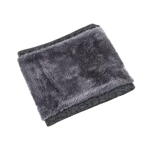Close-up of gray thermal neck warmer showing soft fleece texture and knitted edges