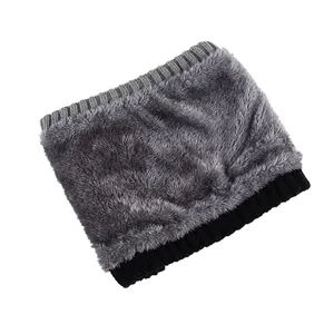 Detail of warm winter neck warmer showing the thick grey plush lining and knit texture