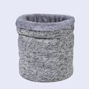 Detail of gray tie-dye knitted neck warmer showing thick thermal fleece lining texture
