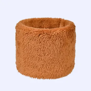 Macro shot of thick brown plush faux fur neck warmer with soft fluffy texture detail