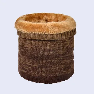 Detail of warm winter neck warmer showing thick striped knit and soft fleece lining