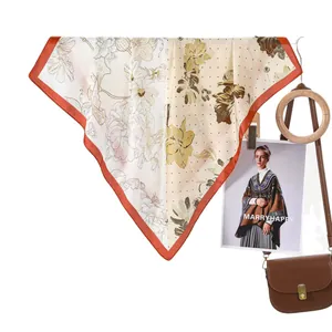 Floral print silk square scarf with polka dots and orange border for elegant styling
