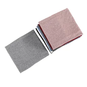 Macro detail of ribbed knit winter neck warmers in multiple colors with elastic texture