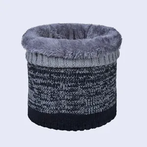 Close-up of thick knit neck warmer with deep blue exterior and soft grey fleece lining