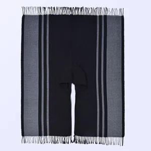 Ethnic style hooded knitted poncho with striped pattern and fringe details in black