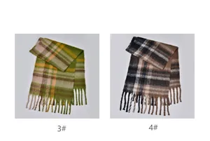 Detail of thick plaid scarves with fringes in green-yellow and brown-grey color schemes