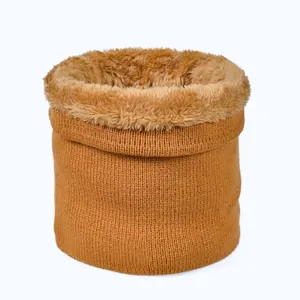 Close-up of caramel knitted neck warmer featuring thick faux fur lining for winter heat